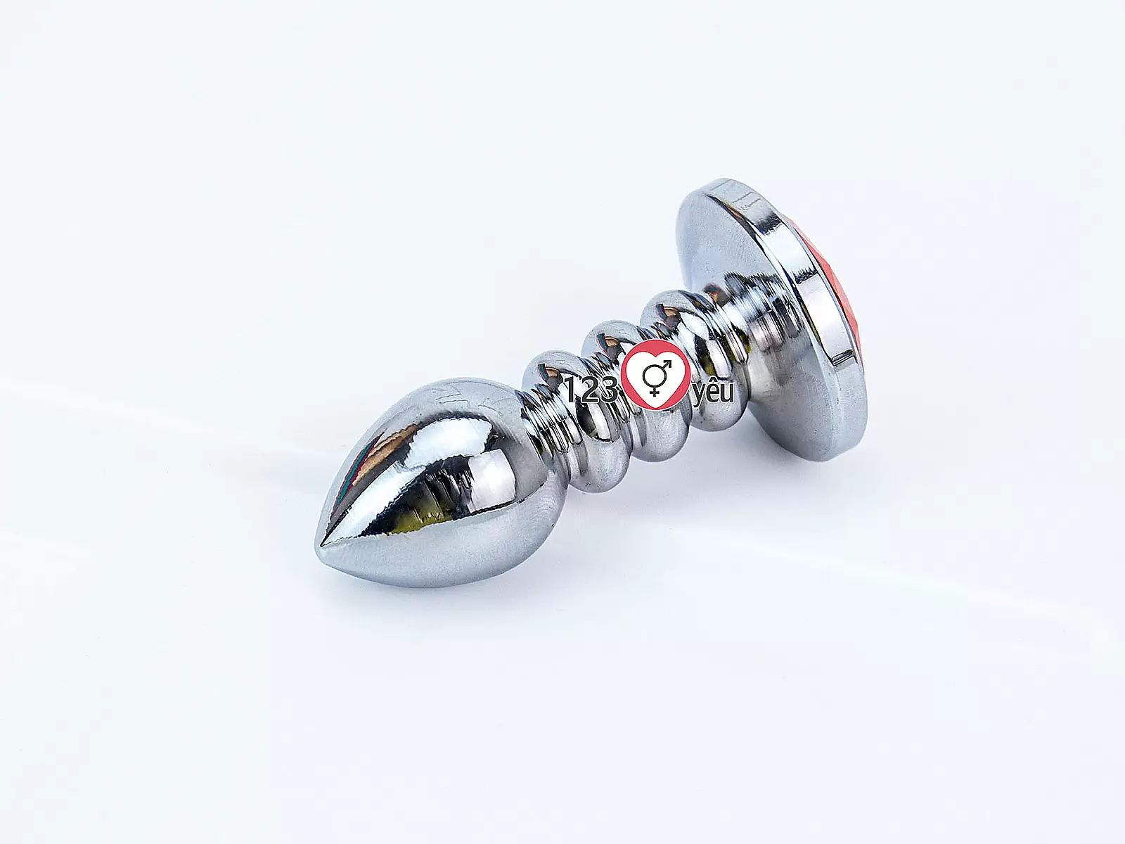 Đồ chơi kích hậu Inox xoắn ốc đuôi pha lê màu cam