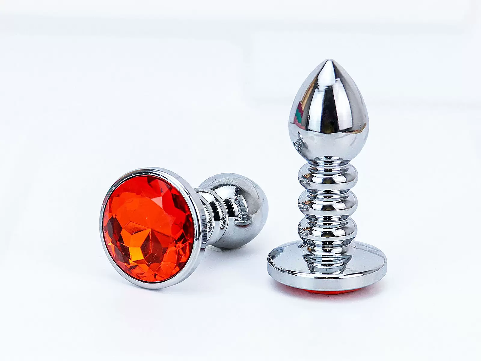 Đồ chơi kích hậu Inox xoắn ốc đuôi pha lê màu cam